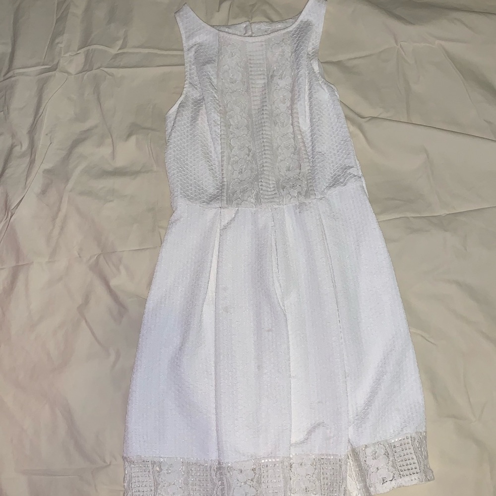 White, high necked dress.